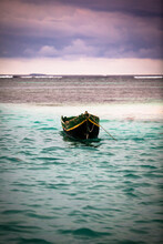 A Colorful Old Traditional Canoe Used By The Kuna People Of The San Blas Islands In The Caribbean Sea During Sunset.