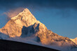 © Tandem Stock - Two hikers on a ridge below Ama Dablam give scale to the massive peak in Nepal's Khumbu region.