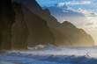 © Tandem Stock - The fluted ridges of the Na Pali Coast rise above the crashing surf on the north shore of Kauai, Hawaii.