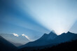 © Tandem Stock - The peaks of Nuptse, Everest, Lhotse, and Ama Dablam and a large beam of light as viewed from the village of Tengboche in Nepal.
