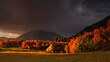 © Tandem Stock - Clouds briefly break, lighting the fall colors during a rainstorm over Mt Timpanogas.