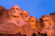 Ambient Pre-dawn Light Illuminates The Features Of The Presidents Of Mount Rushmore, South Dakota.