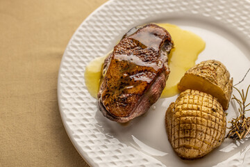 Wall Mural - Duck breast with orange sauce and potatoes