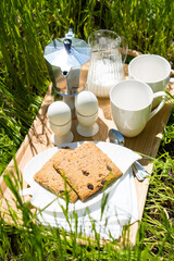 Wall Mural - Breakfast for two on the lawn in the garden