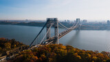 Aerial of George Washington Suspension Bridge over Hudson River at Autumn Sunrise - Interstate 95, US Route 1 & 9 - Fort Lee, New Jersey & Bronx, New York City, New York