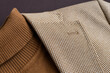 Men outwear flat lay close up, fashionable mens brown sweater combined with light beige blazer on. 