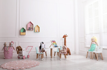 Poster - Cute child's playroom with toys and modern furniture. Interior design