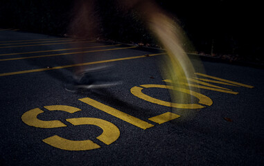 Fast running over slow sign on pavement