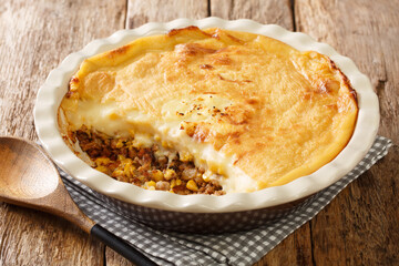 Canvas Print - Quebec variety of Shepherd's pie baked close-up in a baking dish on the table. Horizontal