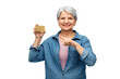 © Syda Productions - money, finance and old people concept - portrait of smiling senior woman with credit card over white background