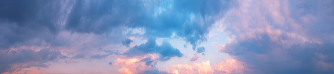 Wall Mural - panorama of cloudy sky with pink clouds