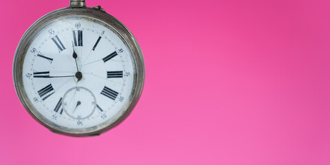 Wall Mural - Close up view of old pocket watch on pink background