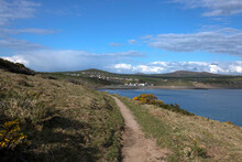 LLyn Peninsula Coastal Path In Wales.  With The Village Of Aberdaron In The Background