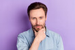 © deagreez - Photo of thoughtful confident young gentleman dressed jeans outfit arm chin isolated violet color background