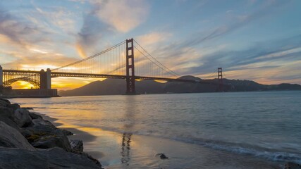 Wall Mural - Time Lapse, amazing golden hour sunset by the popular Golden Gate Bridge in San Francisco, California 