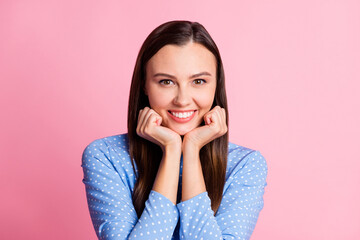 Sticker - Photo of adorable young lady palms cheekbones toothy smile wear dotted blue shirt isolated pastel pink color background