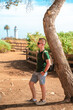 © KseniaJoyg - A young male tourist walks along the waterfront with a view of the Point Vicente Lighthouse in Los Angeles