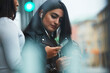 © Johnér - Young woman using cell phone