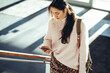 © Jacob Lund - Female student in campus using mobile phone