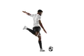 One African man football player training isolated on white background. Concept of sport, movement, energy and dynamic.