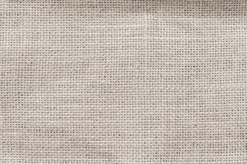 Wall Mural - jute hessian sackcloth woven burlap texture background in sepia cream old aged brown color