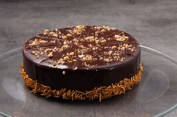 Wall Mural - chocolate cake with nuts and pastry sprinkles