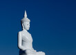 White Buddha over blue sky in Thailand