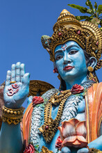 Detail Stone Statue In Indian Hindu Temple On Blue Sky Background