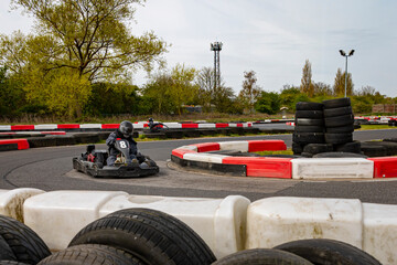 Wall Mural - A panning shot of a racing kart as it circuits a track.