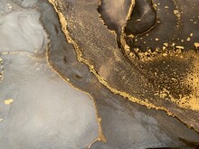 Abstract Gold Art With Black And Grey — Fluid Background With Beautiful Smudges And Stains Made With Alcohol Ink And Golden Pigment. Alcohol Ink Texture Resembles Khokhloma, Watercolor Or Aquarel