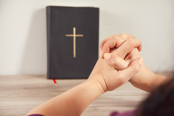 young prayer woman holding Bible