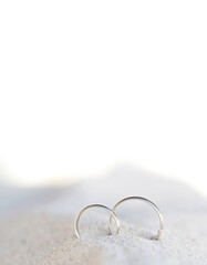 romantic tropical scene on beach. rings on sand
