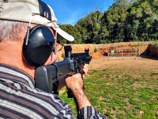 a man shooting with a gun