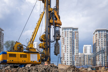 Hydraulic Drilling Rig For Installing A Bored Piles With A Casing String On A Construction Site. Construction Of Drilled Piles For The High-rise Building Foundation