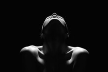 Nude Woman Silhouette In The Dark