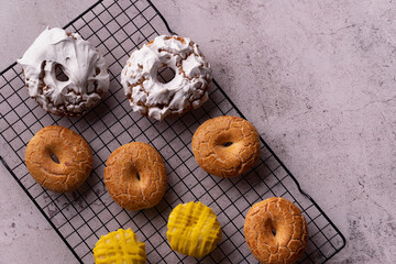 Sticker - Top-view of the delicious glazed donuts of San Isidro in the bakery