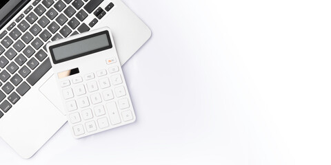 Flat lay, top view office table desk. Workspace with blank clip board, keyboard, office supplies,laptop,Calculator,copy space on white background.