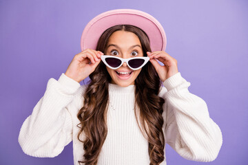 Poster - Photo of young amazed girl shocked surprised news sale hands touch sunglass isolated over purple color background