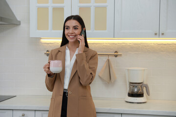 Poster - Young woman talking on phone at home in morning