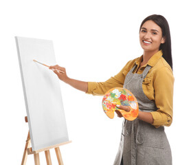 Wall Mural - Young woman drawing on easel against white background