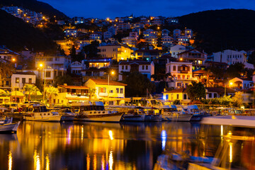 Kas Harbour at night as viewed from the sea, Lycian Coast, Turkey