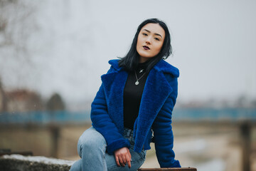 Poster - Young caucasian female in a fur coat in outdoors