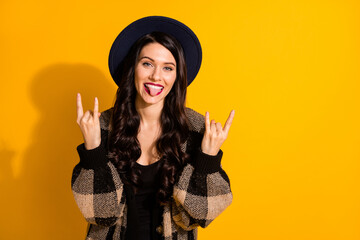 Sticker - Photo of funky hipster lady show horns tongue out wear black hat plaid jacket isolated yellow color background