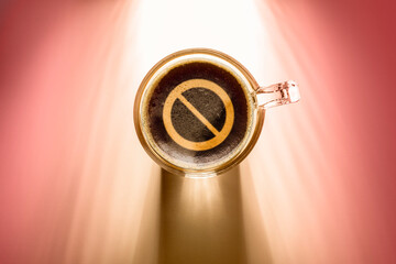 Sticker - coffee cup with prohibition sign, top view on background with sunlight.