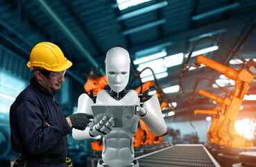 Mechanized industry robot and human worker working together in future factory . Concept of artificial intelligence for industrial revolution and automation manufacturing process .