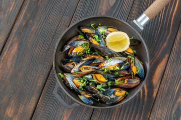 Wall Mural - Fried mussels on the frying pan