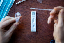 Close Up Of A Person Using Coronavirus Covid-19 Rapid Antigen Home Testing Kit