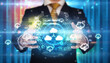 © ra2 studio - Businessman holding technology icon concept