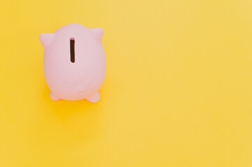 Poster - Top view of a pink piggy bank isolated on a yellow background