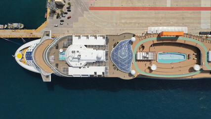  Aerial drone top down photo of huge cruise liner anchored in Mediterranean port top deck facilities